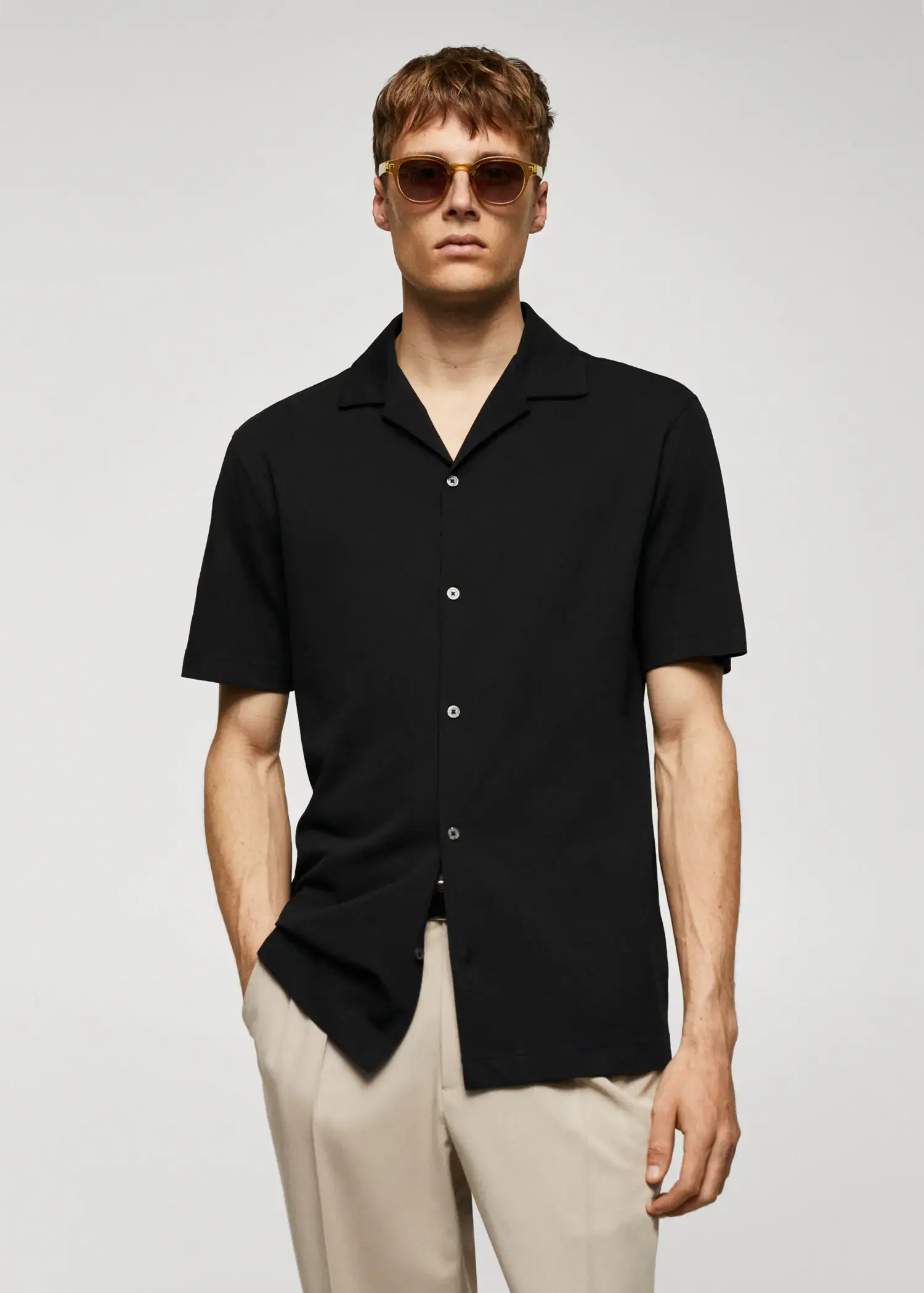 Mango Bowling-collar pique shirt. a man wearing a black shirt and sunglasses. 
