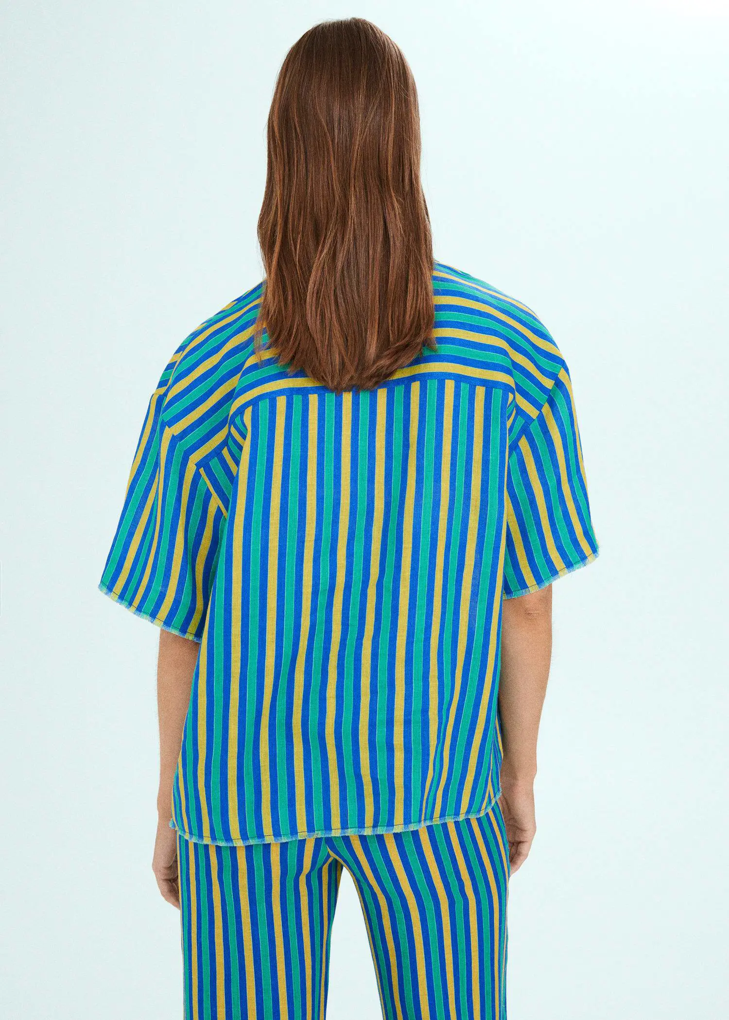 Mango Multi-coloured striped linen shirt. a person with long brown hair wearing a blue and yellow shirt. 