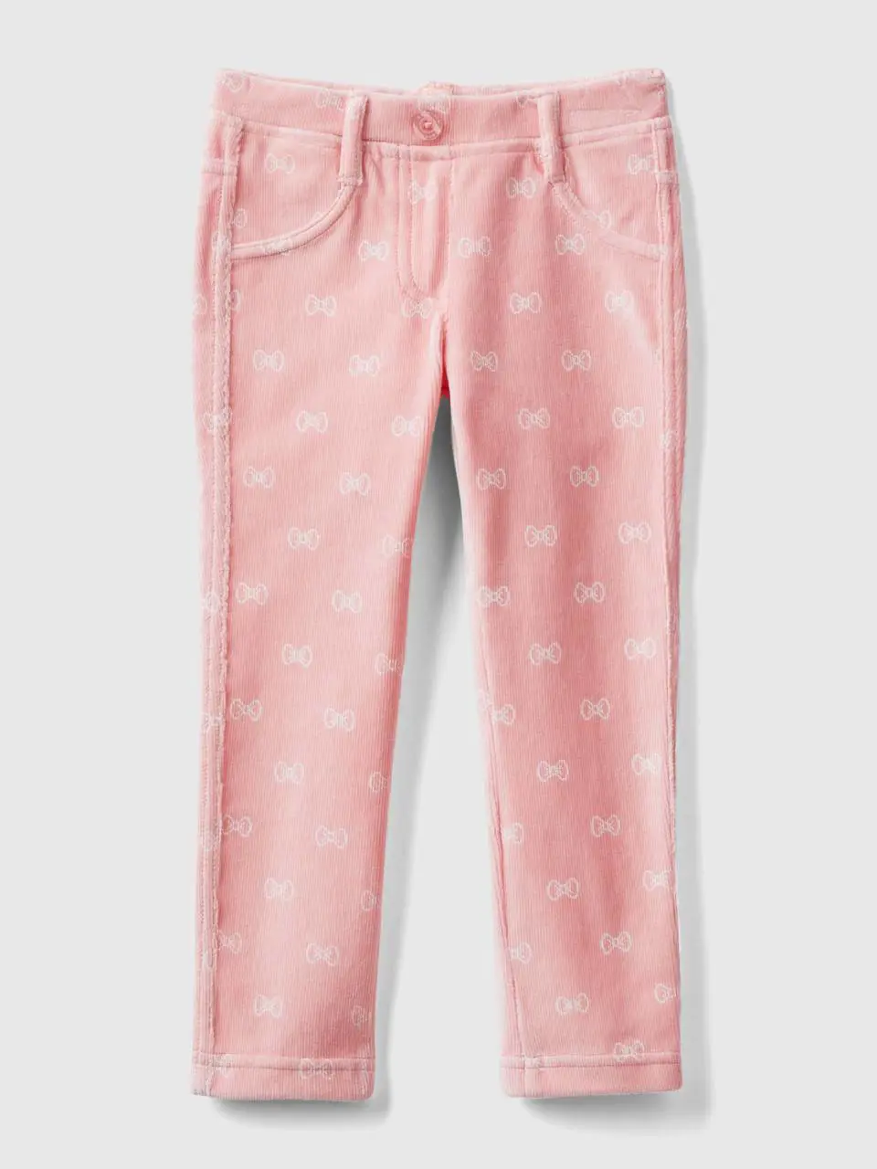 Benetton pink jeggings with bow print. 1