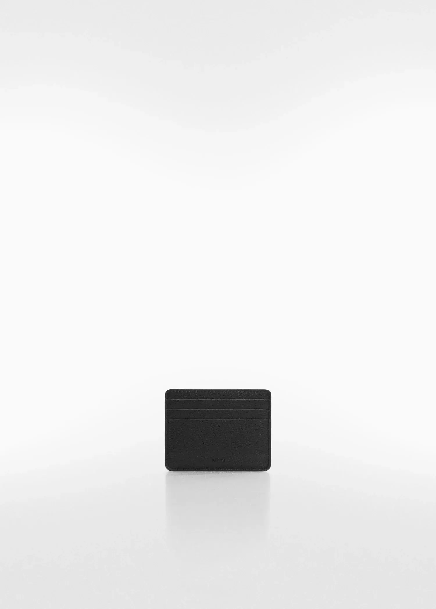 Mango Anti-contactless leather-effect card holder. a square black object sitting on top of a white surface. 