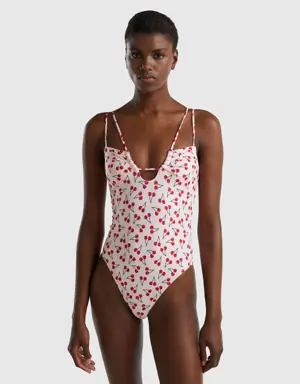 pink one-piece swimsuit with cherry pattern