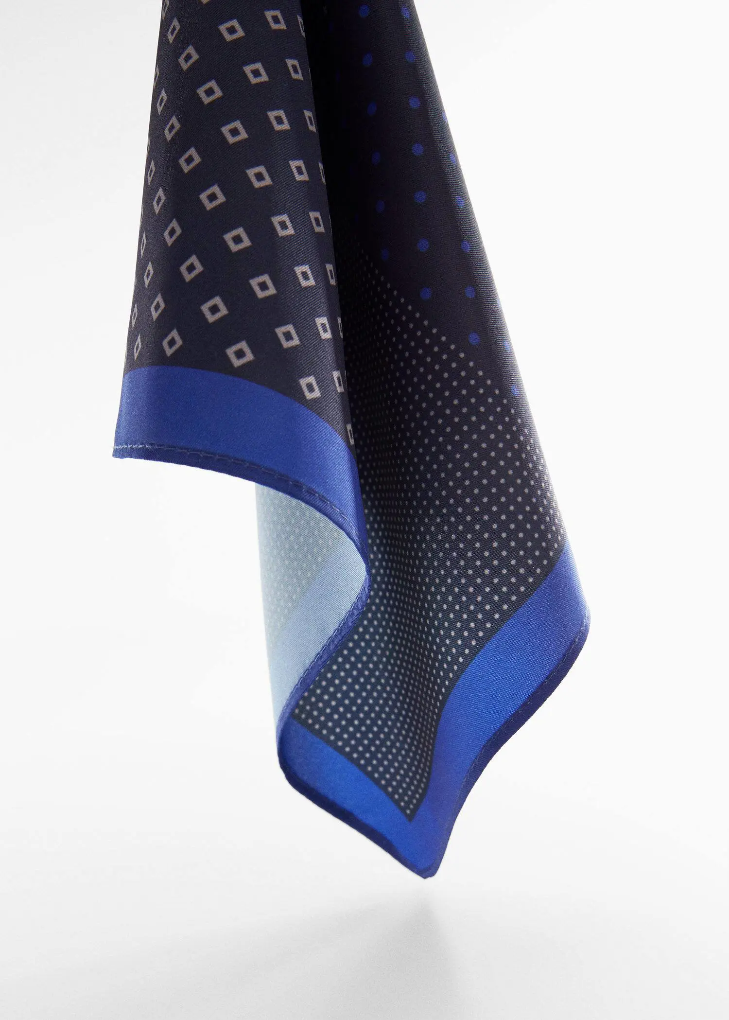 Mango Printed pocket square. a close-up of a blue and black patterned scarf. 