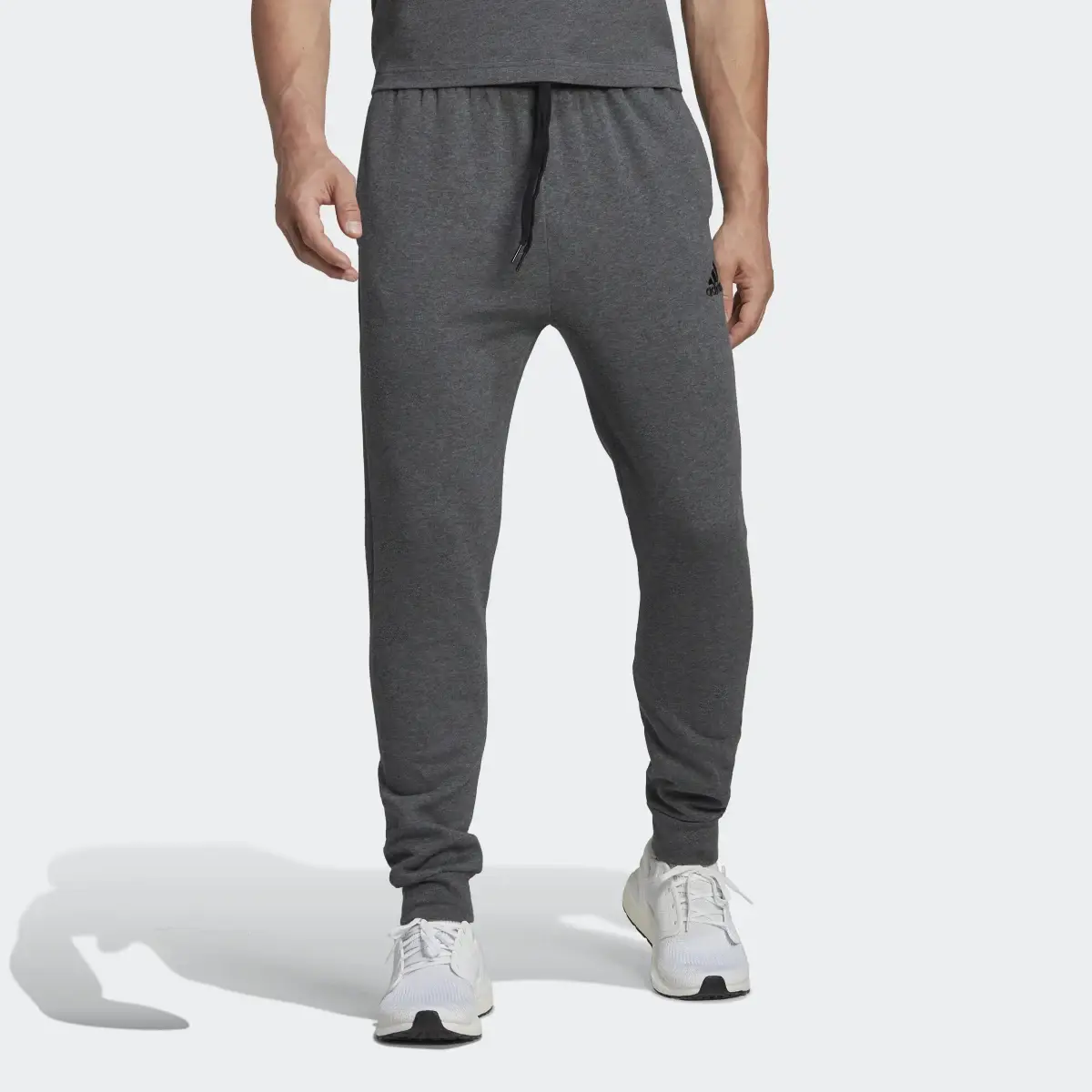 Adidas Essentials Fleece Regular Tapered Pants. 1