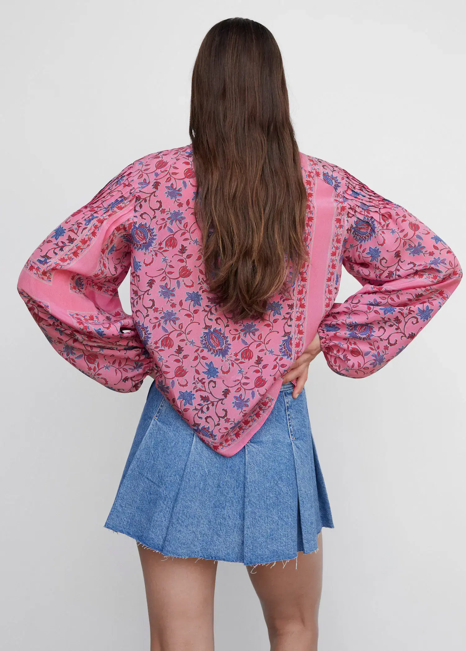 Mango Printed puff sleeve blouse. a woman wearing a pink and blue outfit. 