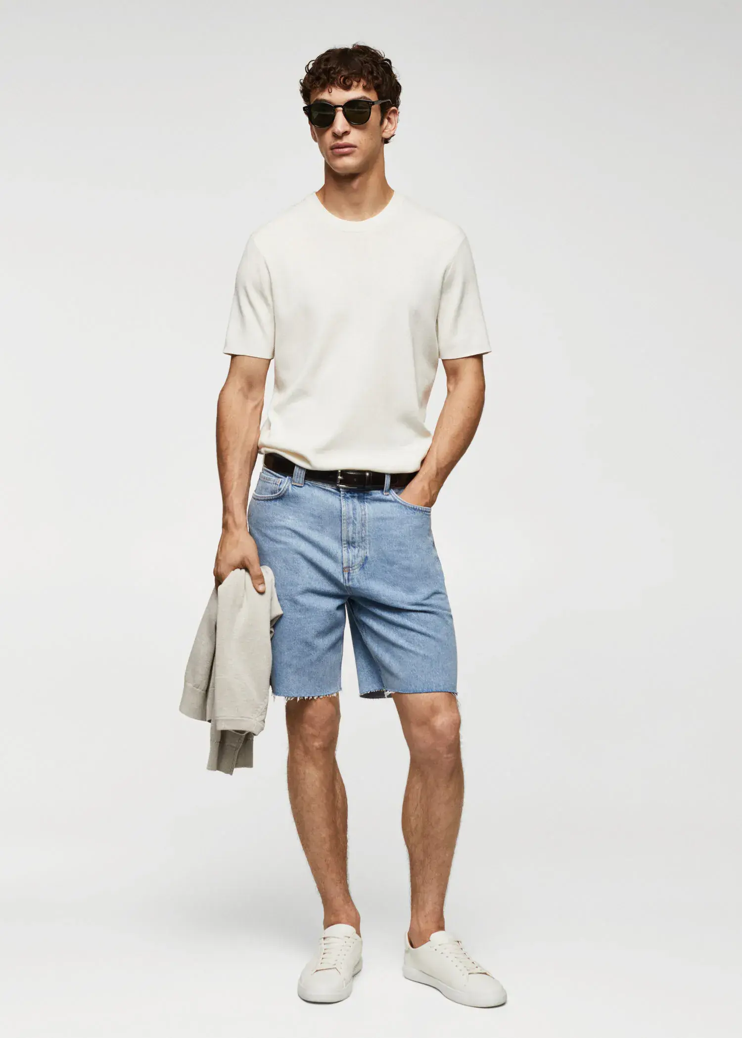 Mango Regular-fit denim bermuda shorts. a man in white t-shirt and blue shorts. 