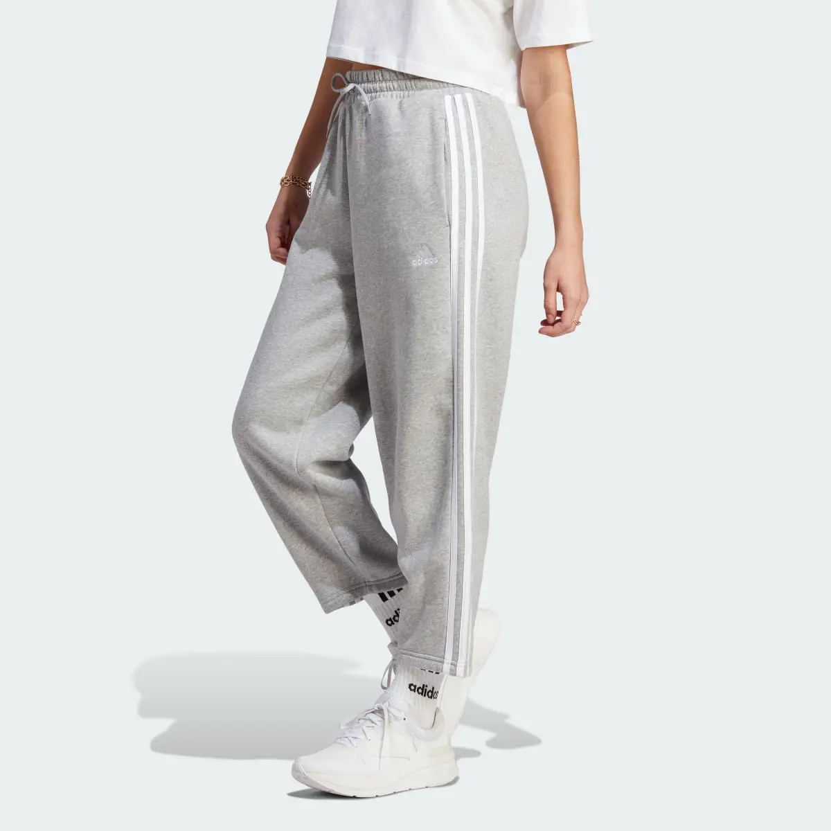 Adidas Essentials 3-Stripes Open Hem Fleece Pants. 1