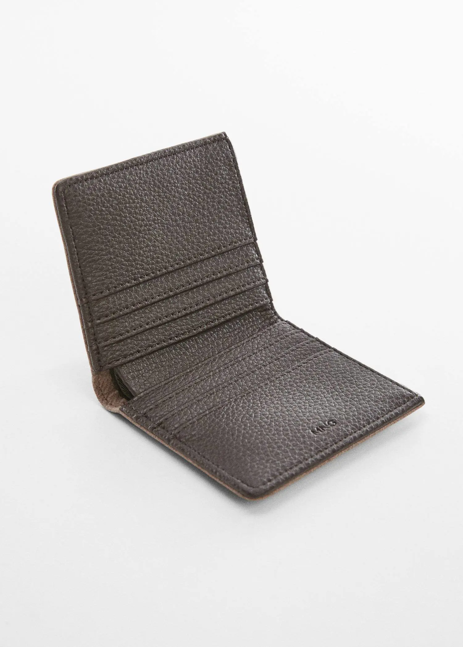Mango Anti-contactless wallet. a brown wallet is sitting on a white surface. 