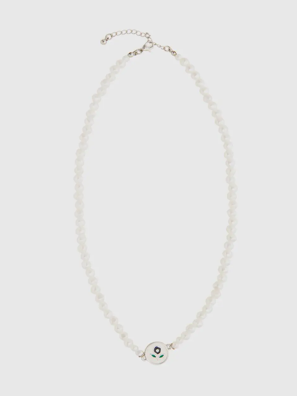 Benetton white pearl necklace with dark blue flower. 1