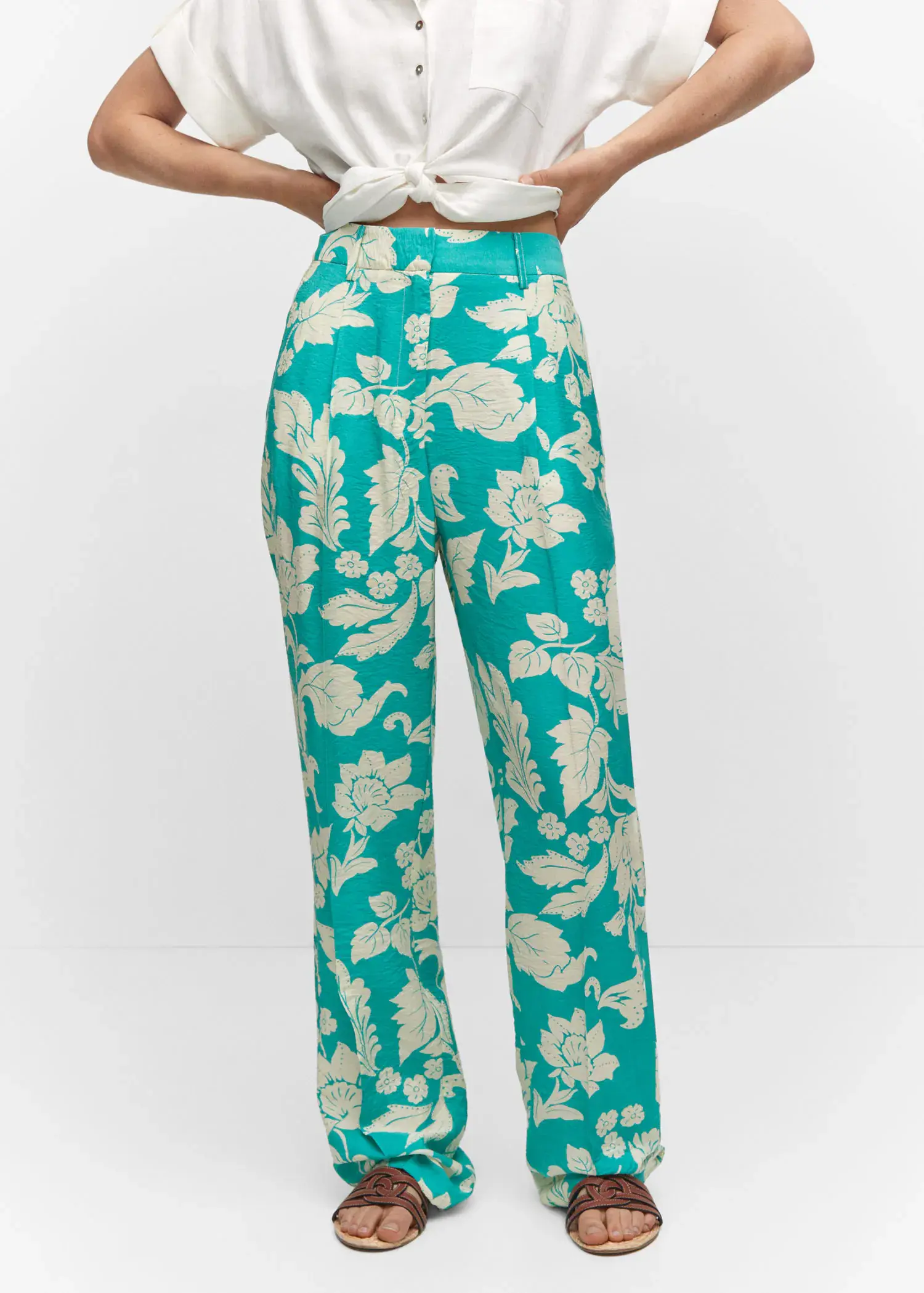 Mango Printed straight pants. a person standing in front of a white wall. 