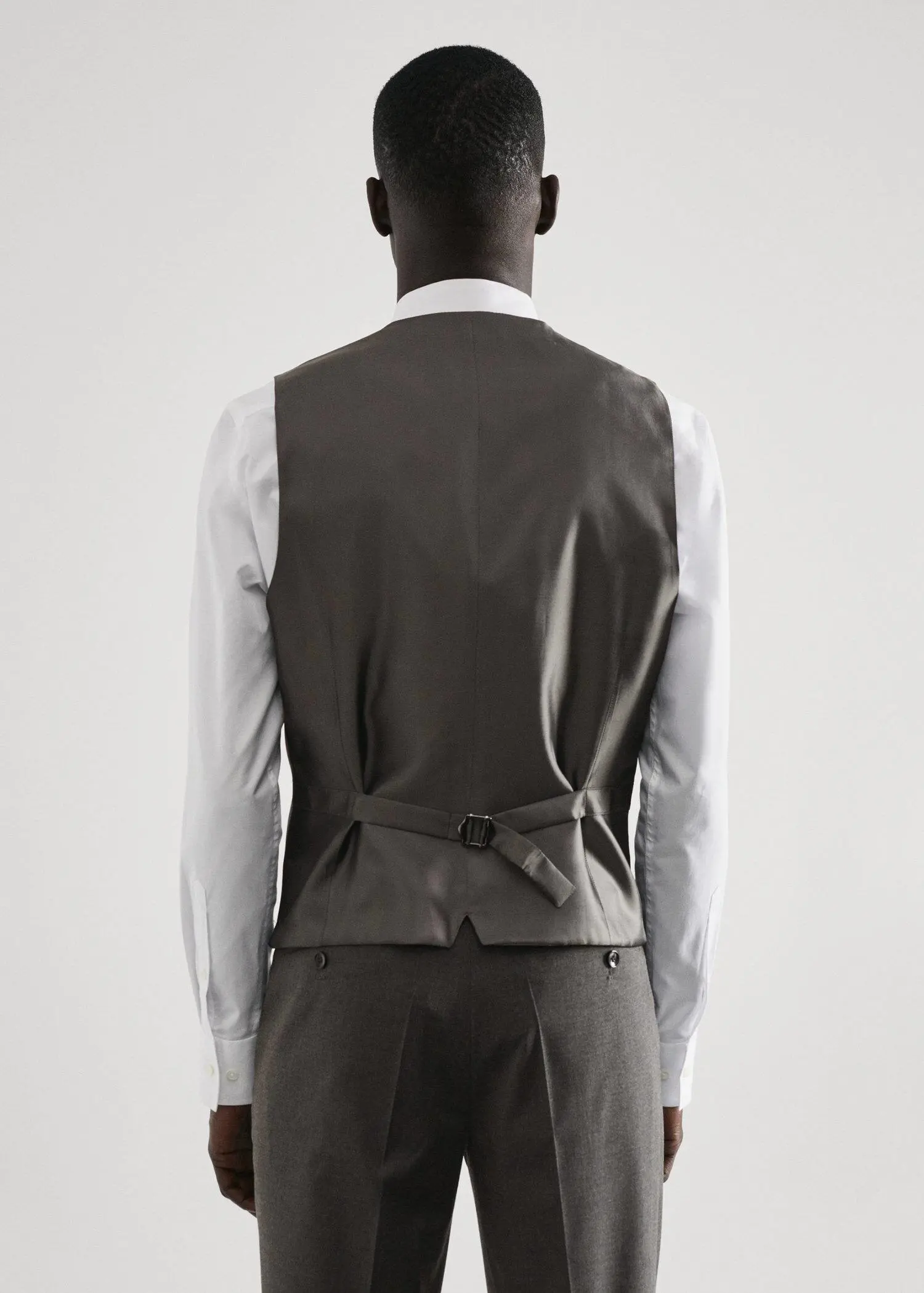 Mango Slim-fit suit waistcoat. a man wearing a suit and a vest. 