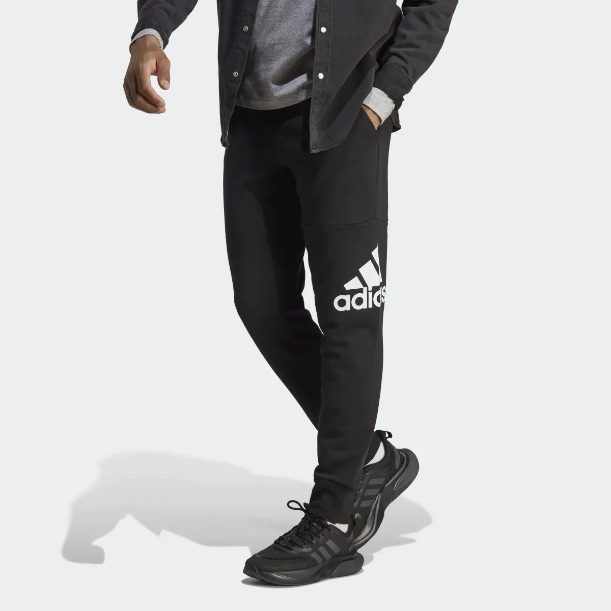 Adidas Essentials French Terry Tapered Cuff Logo Pants. 1