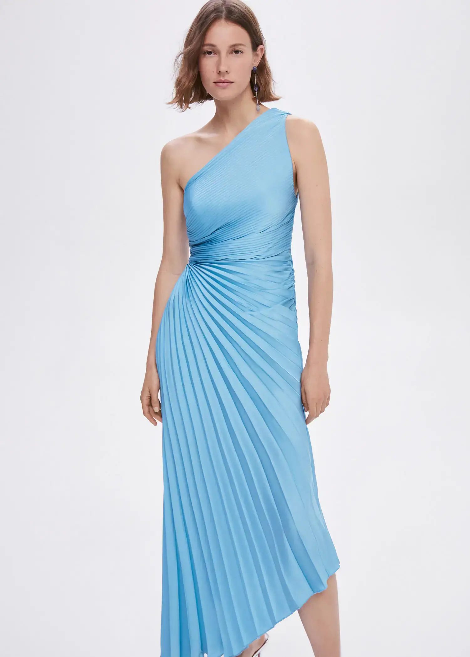 Mango Asymmetrical pleated dress. a woman in a blue dress posing for a picture. 