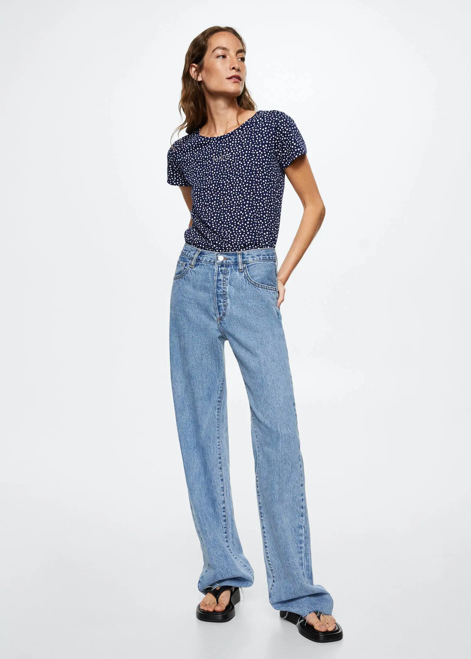 Mango Printed cotton-blend T-shirt. a woman in a blue shirt and jeans. 