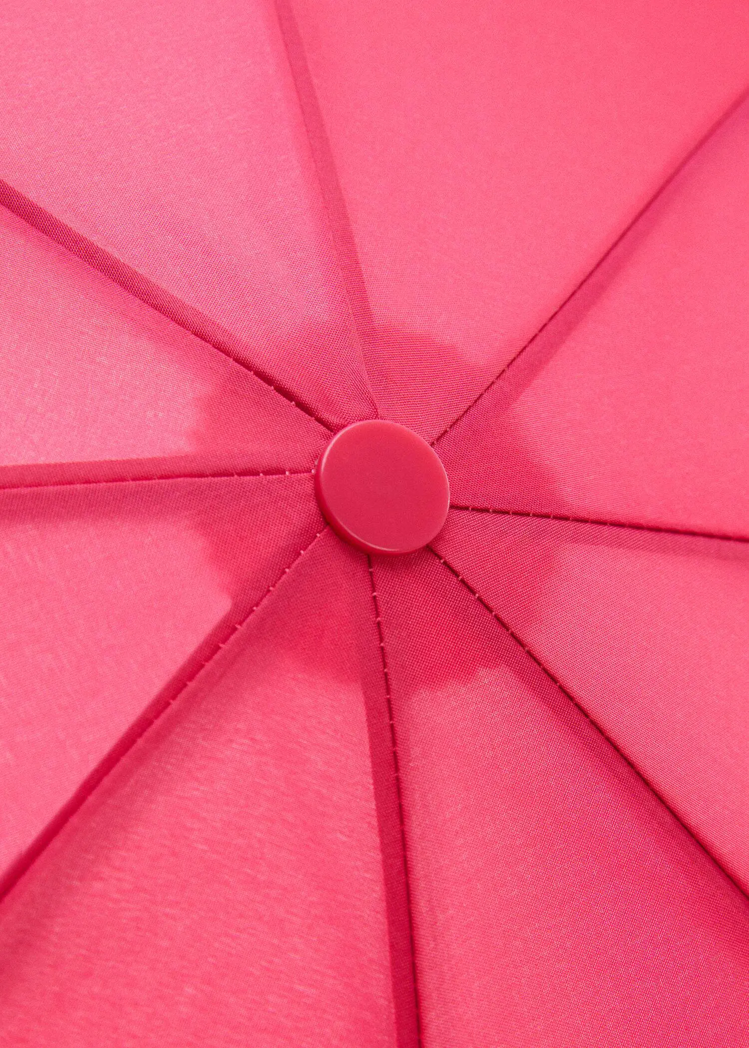 Mango Plain folding umbrella. a close-up view of the inside of an open umbrella. 