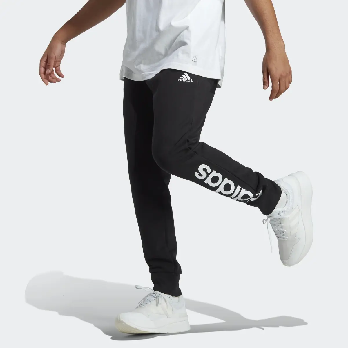 Adidas Essentials French Terry Tapered Cuff Logo Joggers. 1