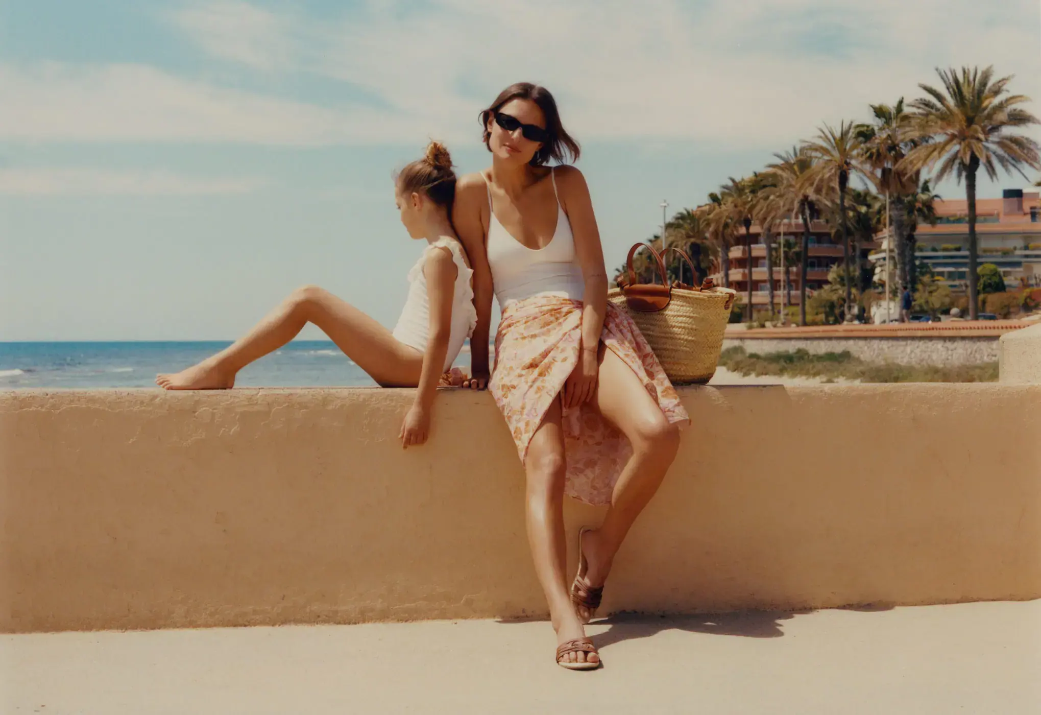 Mango Texture ruffle swimsuit. two young women are posing for a picture. 