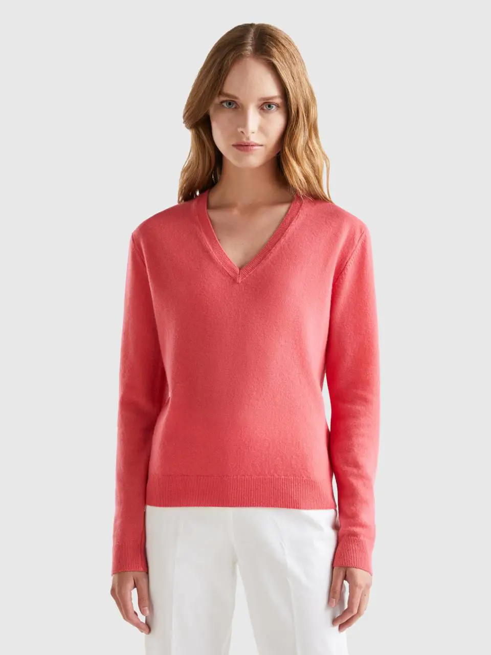 Benetton strawberry red v-neck sweater in pure merino wool. 1