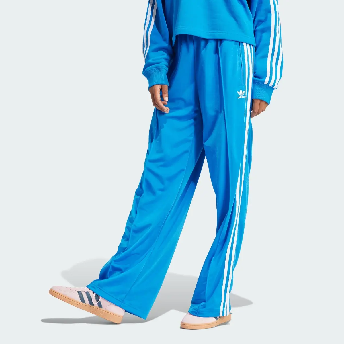 Adidas Pantalon de survêtement ample Firebird. 1
