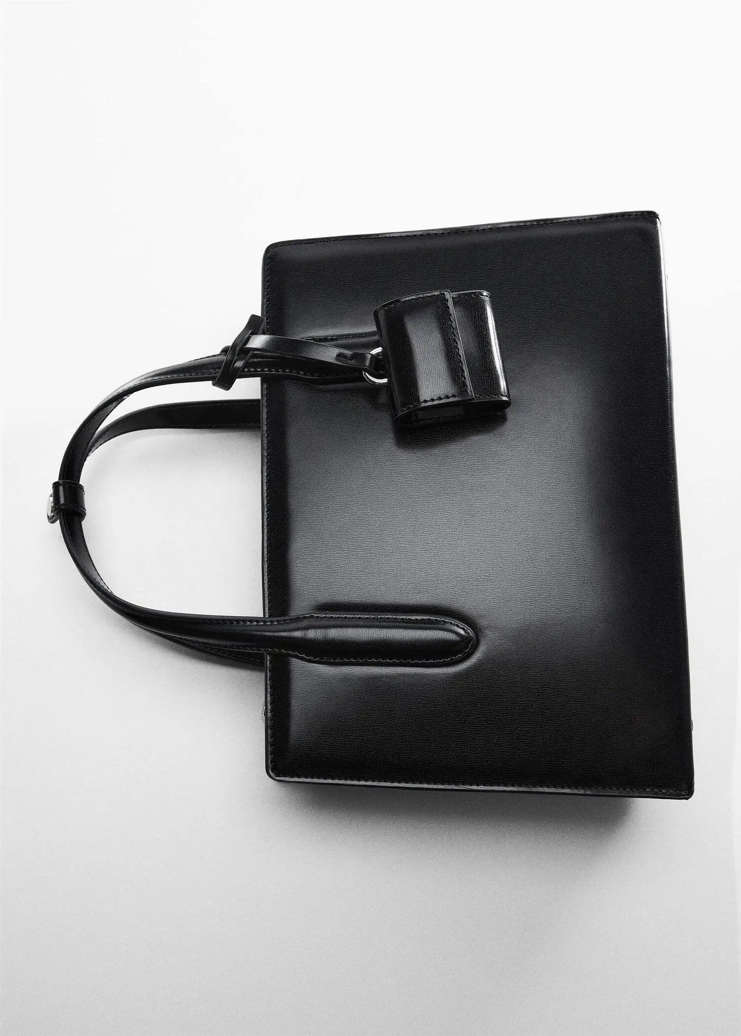 Mango Saffiano-effect shopper bag. a black purse is sitting on a table. 