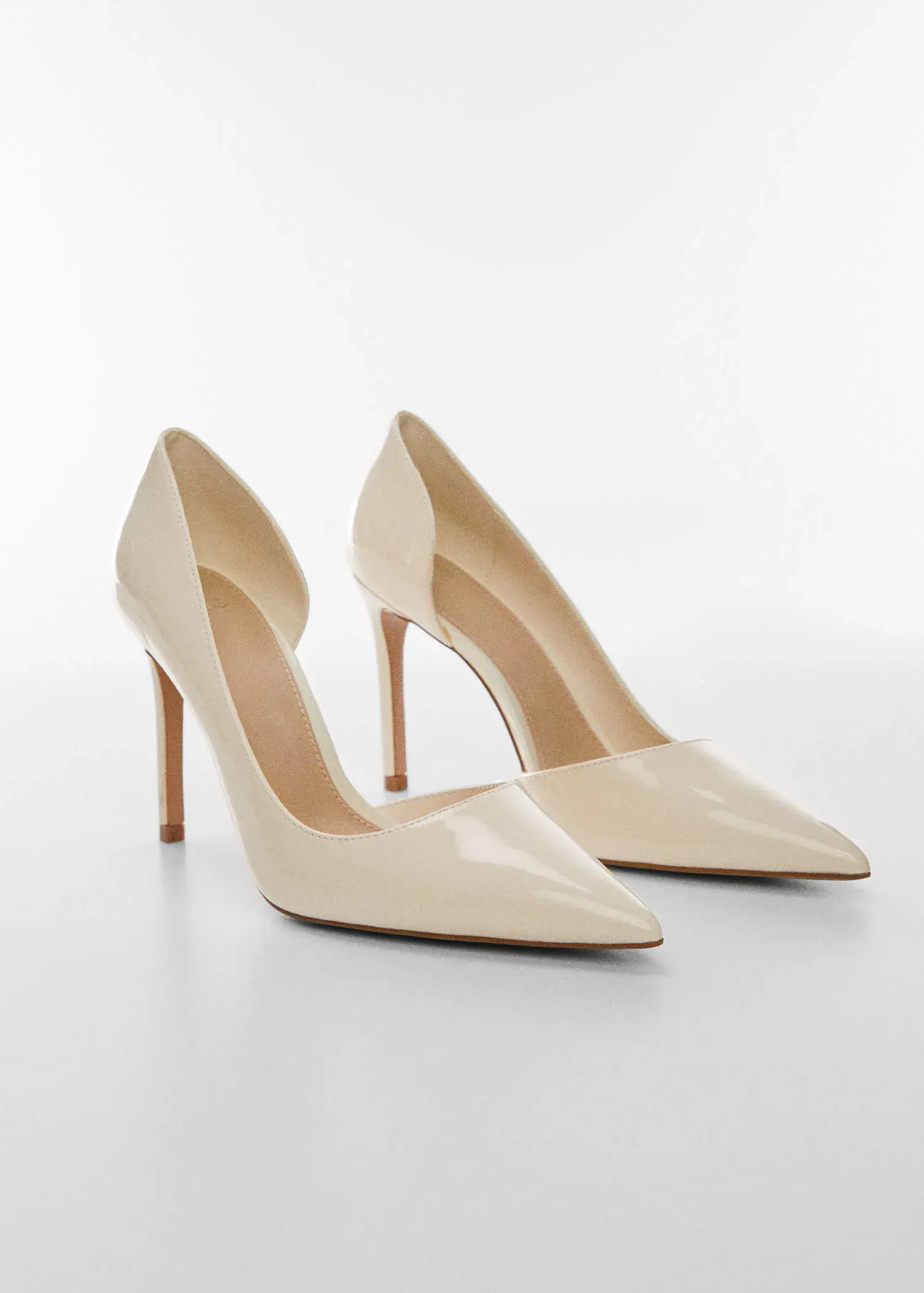 Mango Asymmetrical heeled shoes. a close up of a pair of shoes on a white surface 