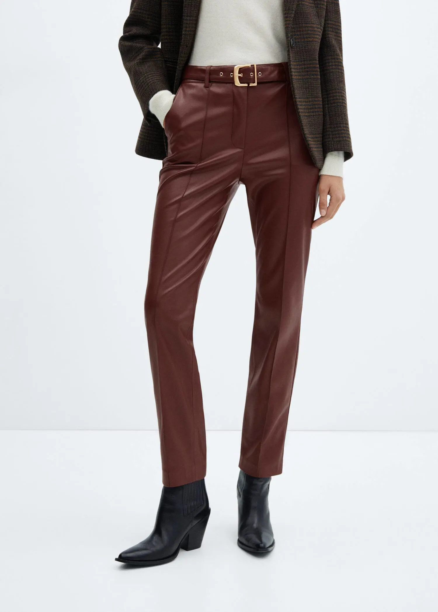 Mango Leather-effect trousers with belt. 2