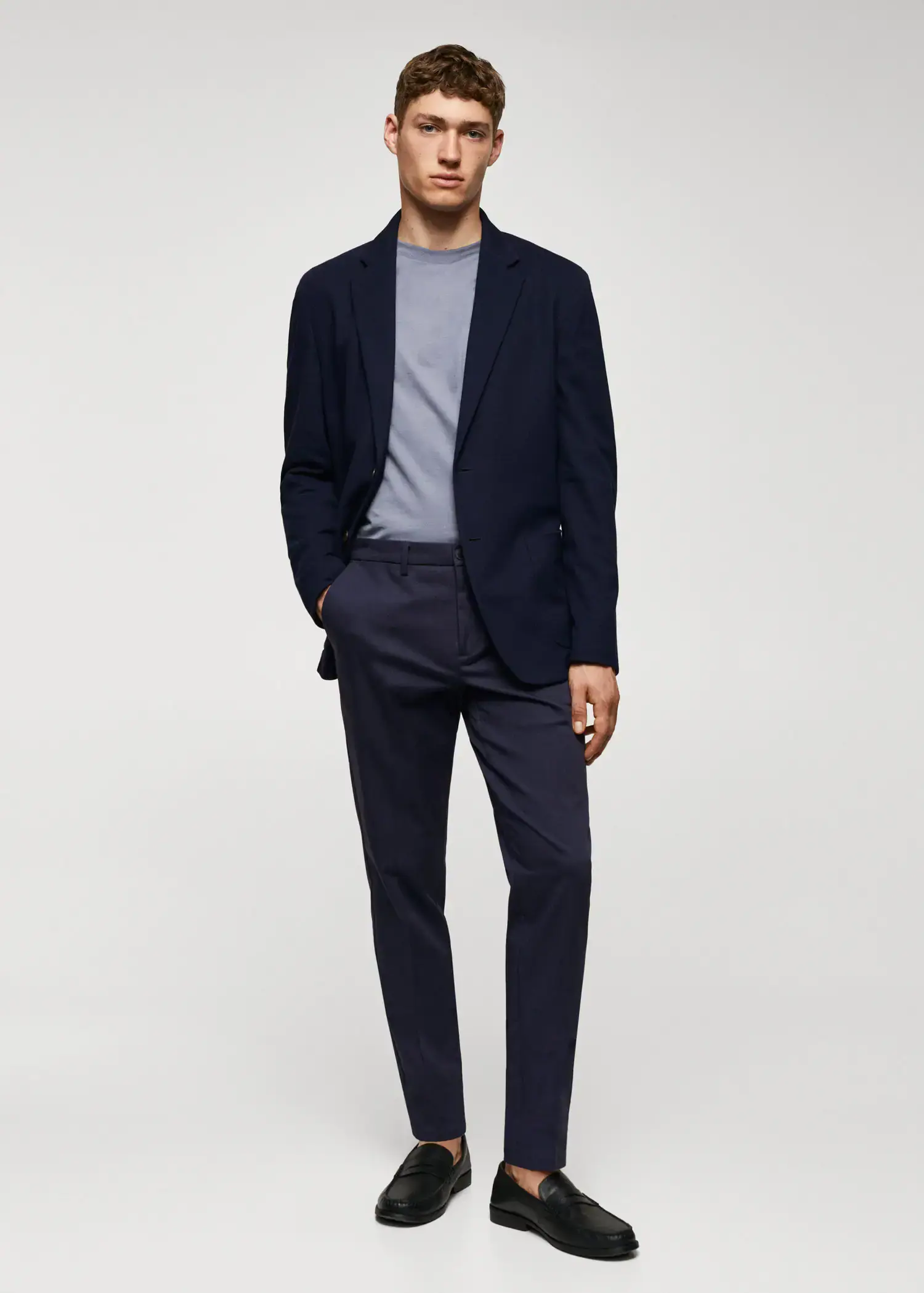 Mango Slim fit chino trousers. a man wearing a suit and a tie. 