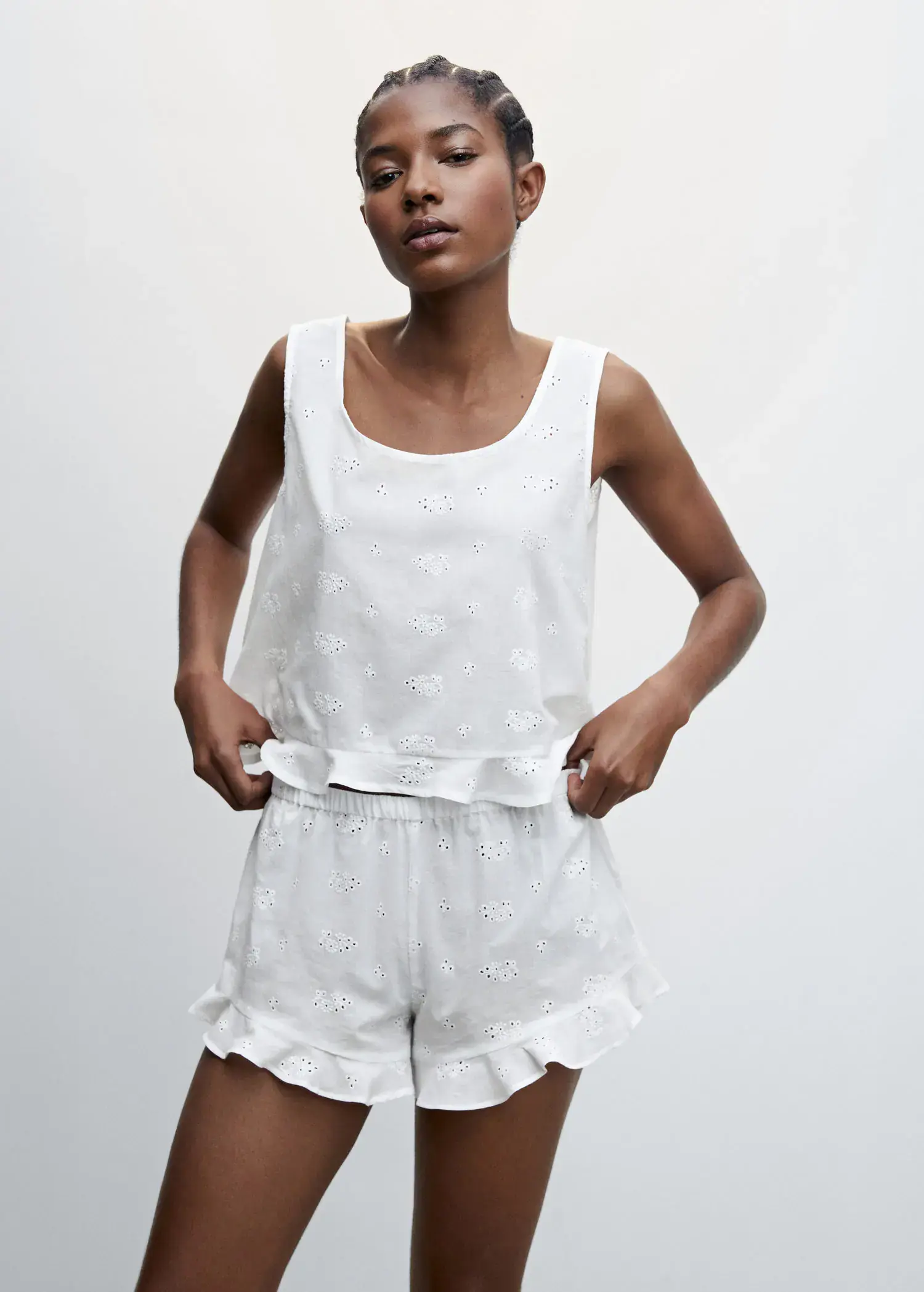 Mango Pyjama top with openwork details. a woman in a white outfit posing for a picture. 