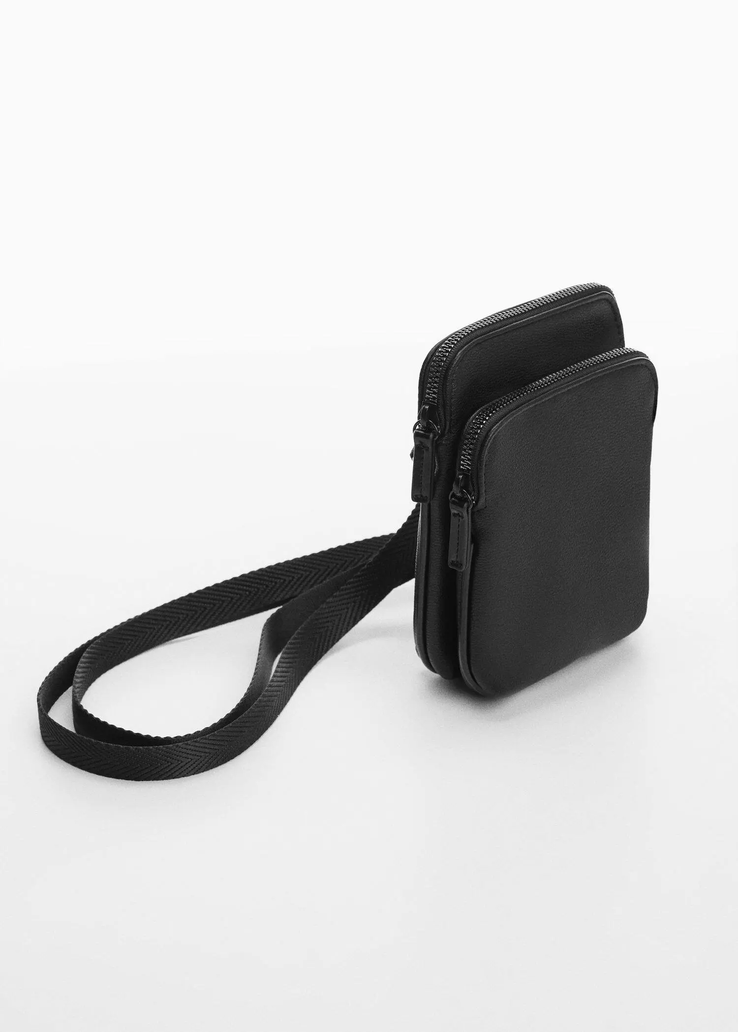 Mango Mini leather-effect shoulder bag. a black purse is sitting on the ground. 