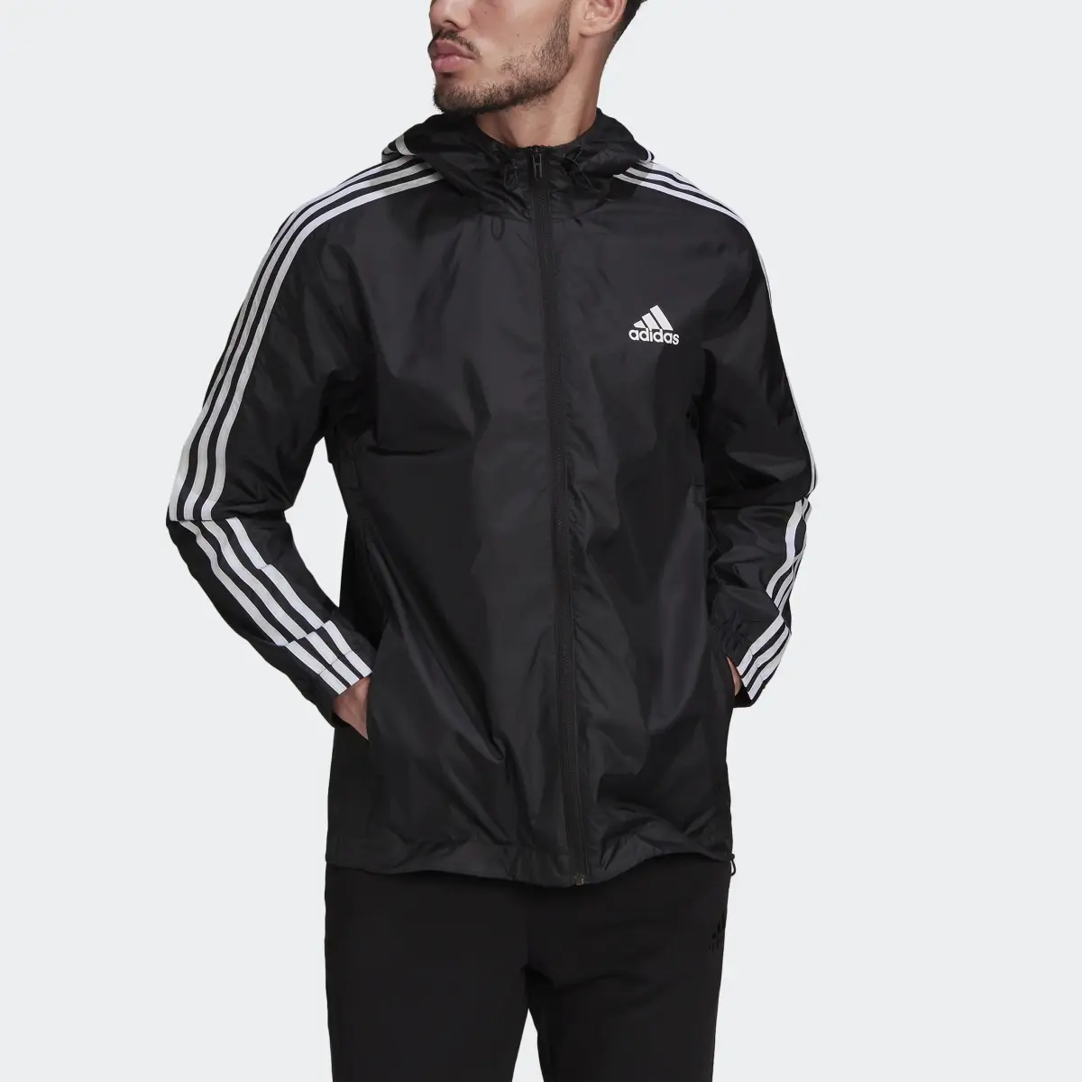 Adidas Essentials 3-Stripes Woven Windbreaker. 1