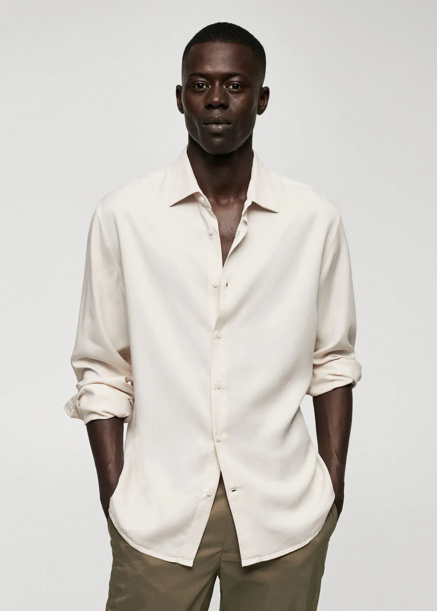 Mango Lyocell fluid shirt. a man wearing a white shirt and a hat. 