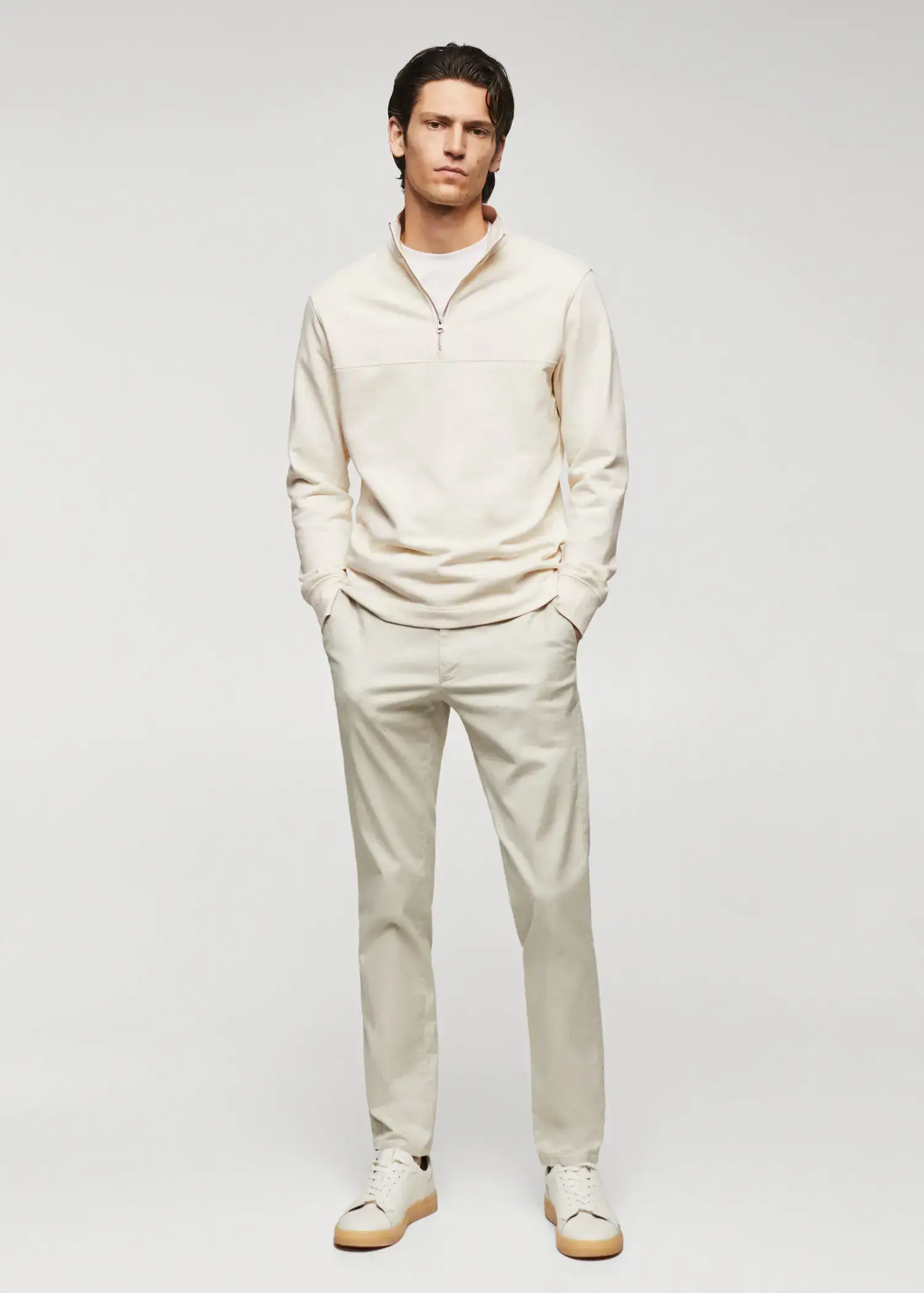 Mango Cotton sweatshirt with zipper neck. a man standing in front of a white wall. 