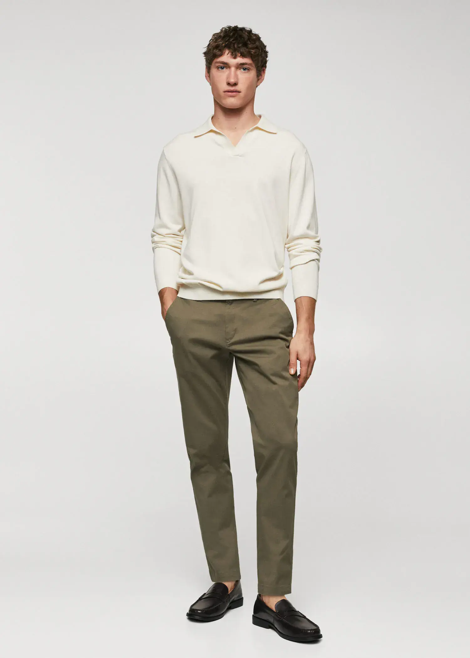 Mango Cotton tapered crop pants. a man in a white shirt and green pants. 