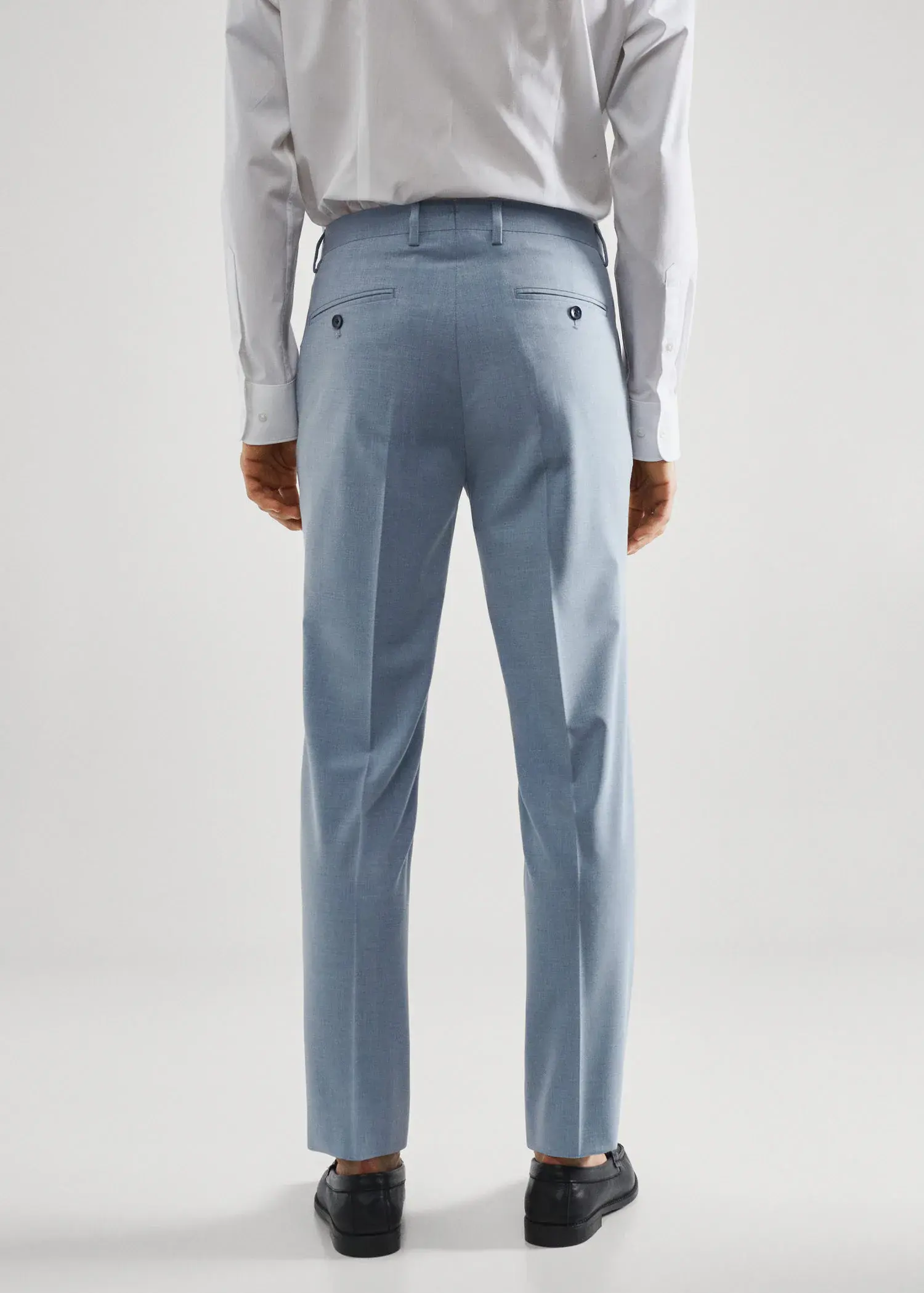 Mango Stretch fabric slim-fit suit trousers. a man wearing a light blue suit and white shirt. 