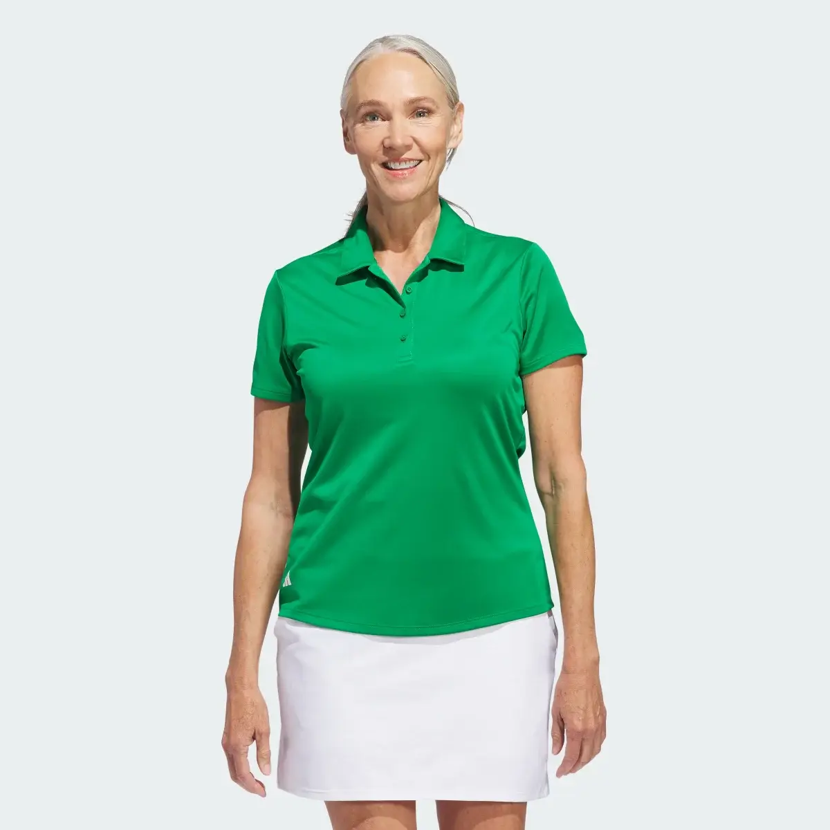 Adidas Women's Solid Performance Short Sleeve Polo Shirt. 2