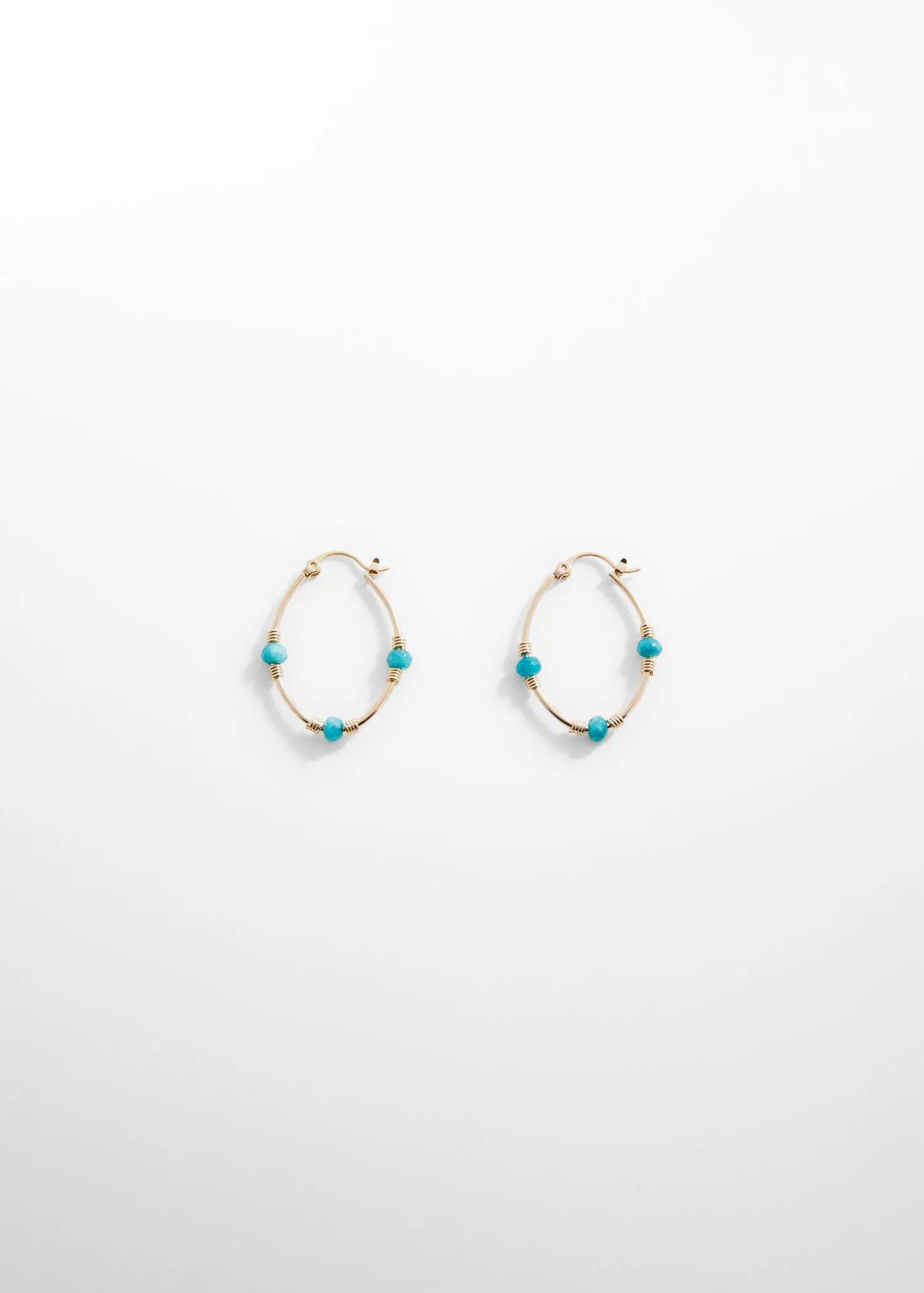 Mango Stone hoop earrings. a pair of gold and turquoise hoop earrings. 