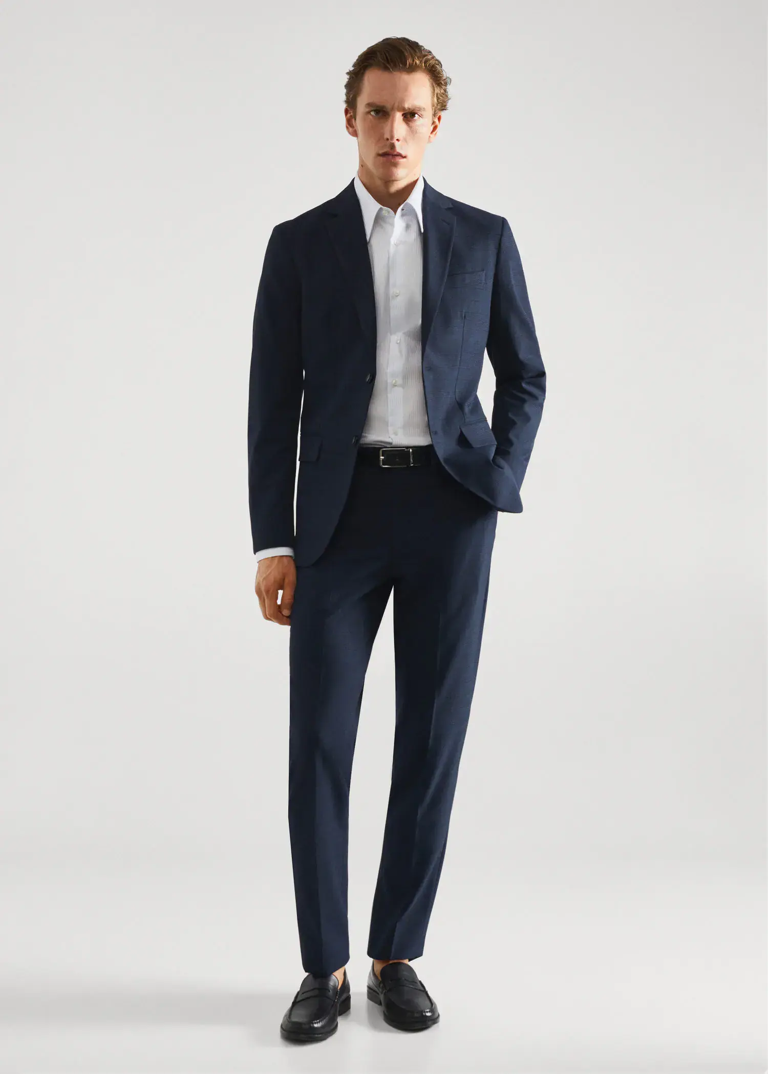 Mango Stretch fabric slim-fit printed suit trousers. a man in a suit and tie standing in front of a white wall. 