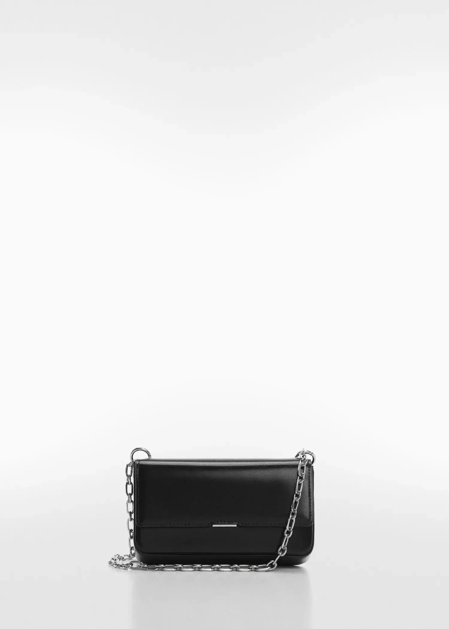 Mango Flap chain bag. a black purse with a silver chain strap. 