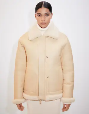 Reversible leather and fur-effect coat