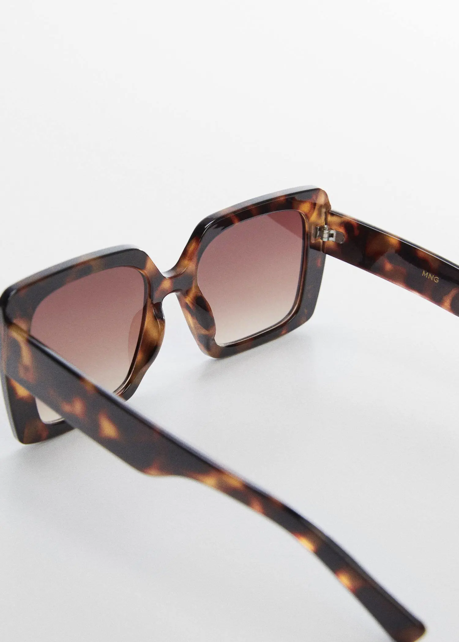 Mango Tortoiseshell square sunglasses. a close up of a pair of sunglasses. 