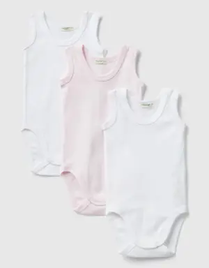 three solid colored tank top bodysuits