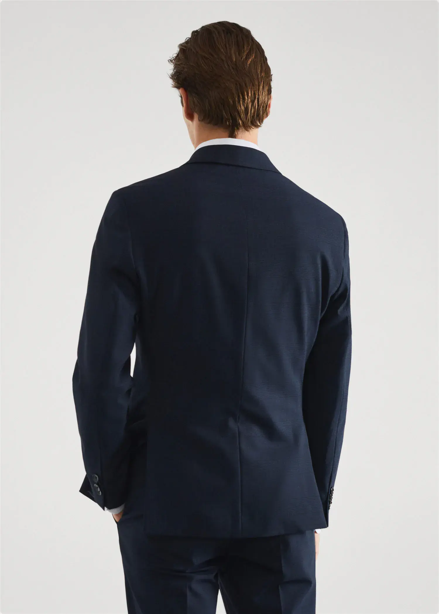 Mango Stretch fabric slim-fit printed suit jacket . a man in a suit standing in front of a white wall. 