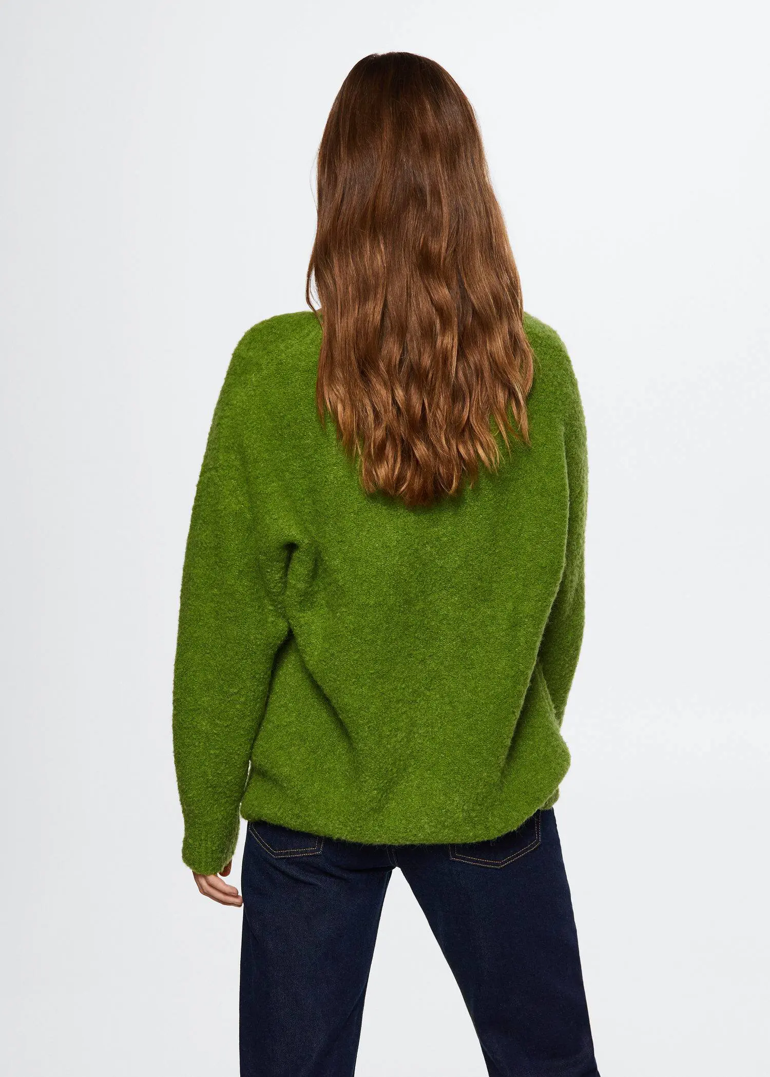 Mango V-neck curly knit sweater. a woman with long red hair is wearing a green sweater. 