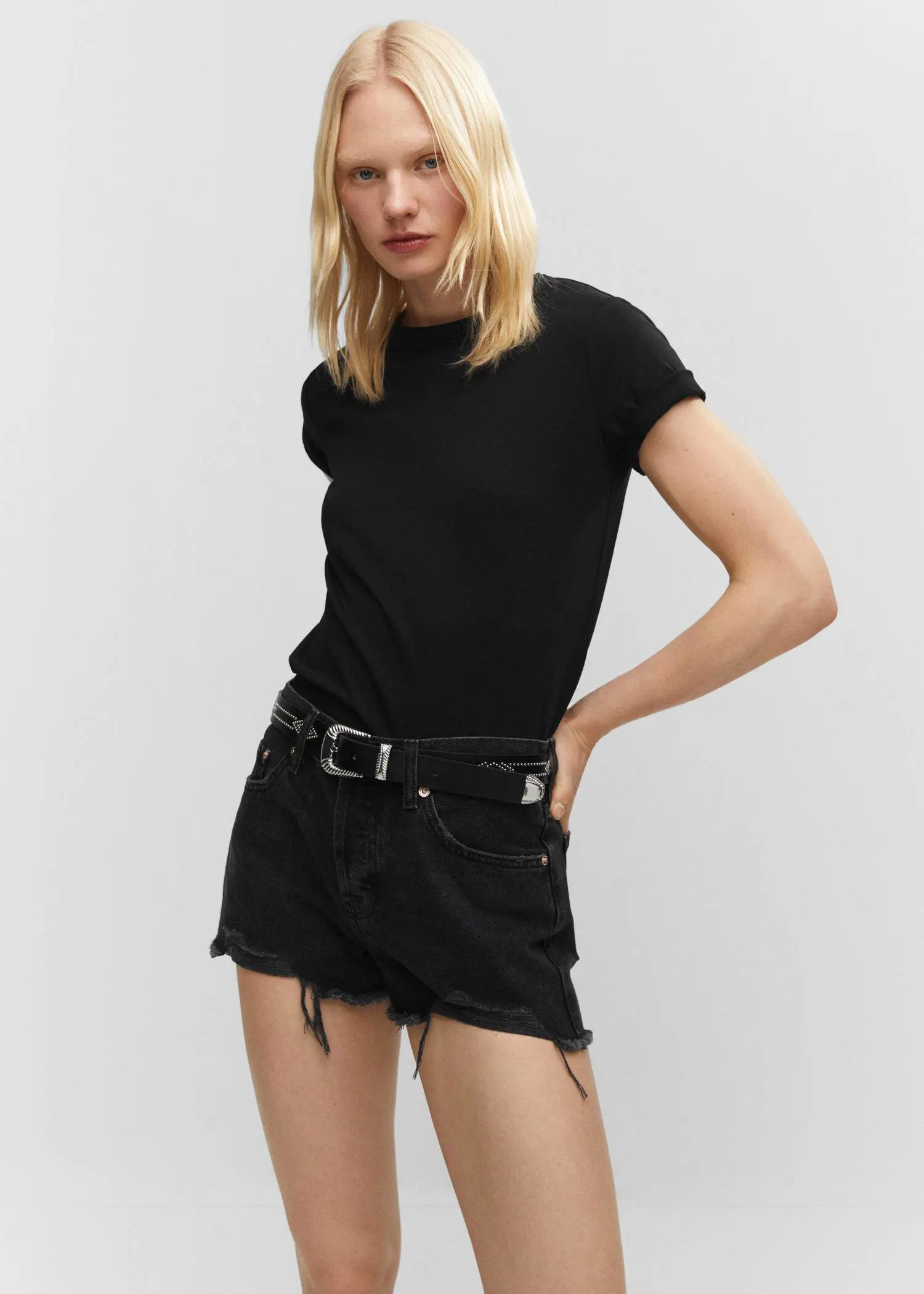 Mango 100% cotton T-shirt. a woman in black shirt and black shorts. 