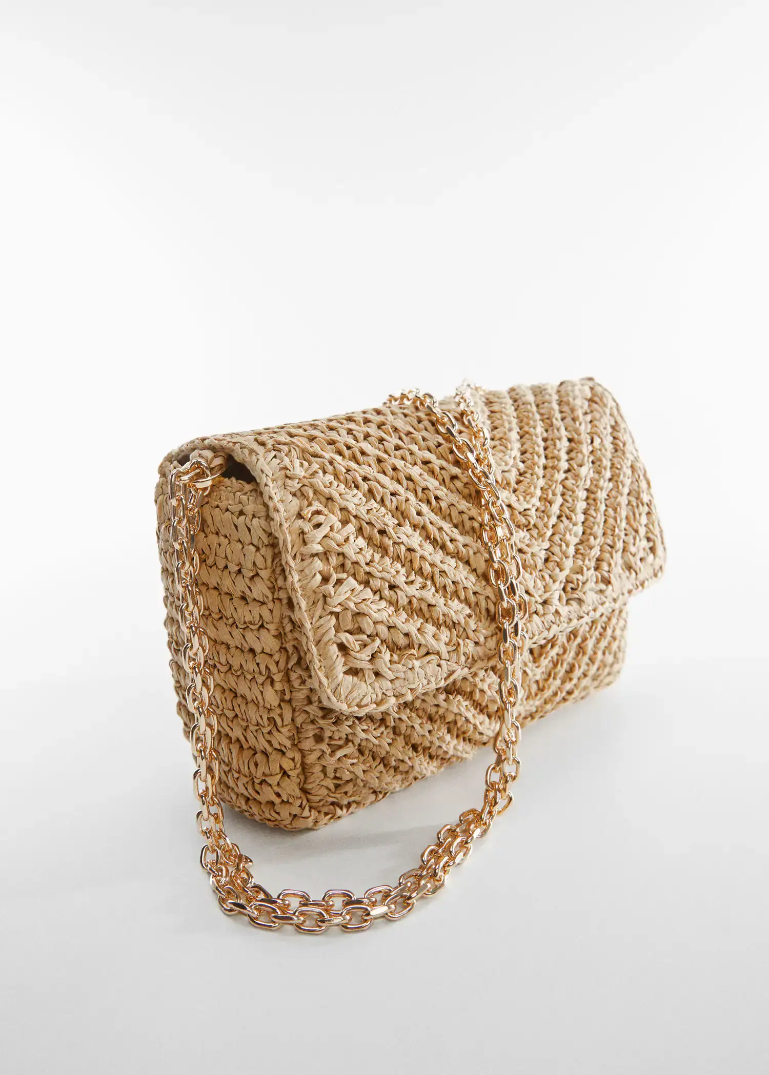 Mango Natural fibre bag with flap. a close-up of a straw purse with a chain strap. 