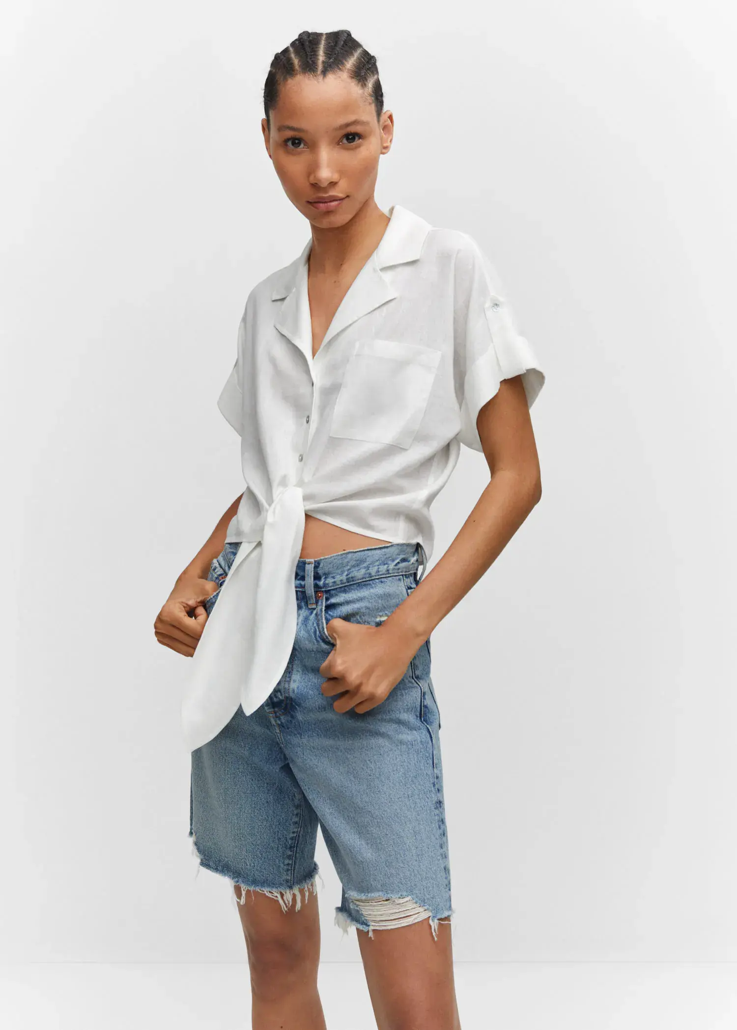 Mango Linen shirt with bow. a person wearing a white shirt and jeans. 