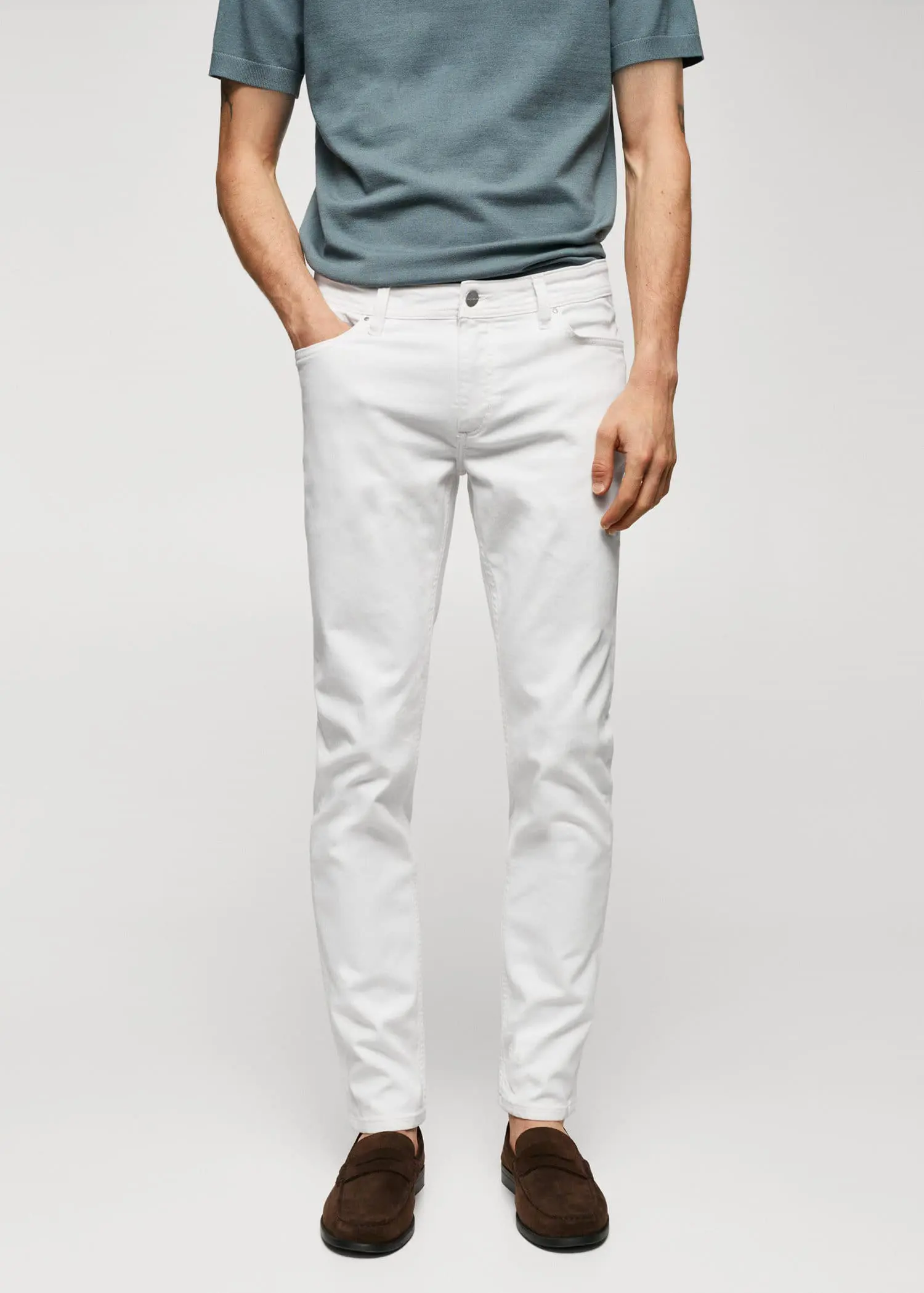 Mango Jan slim-fit jeans. a man in white jeans and a blue shirt. 