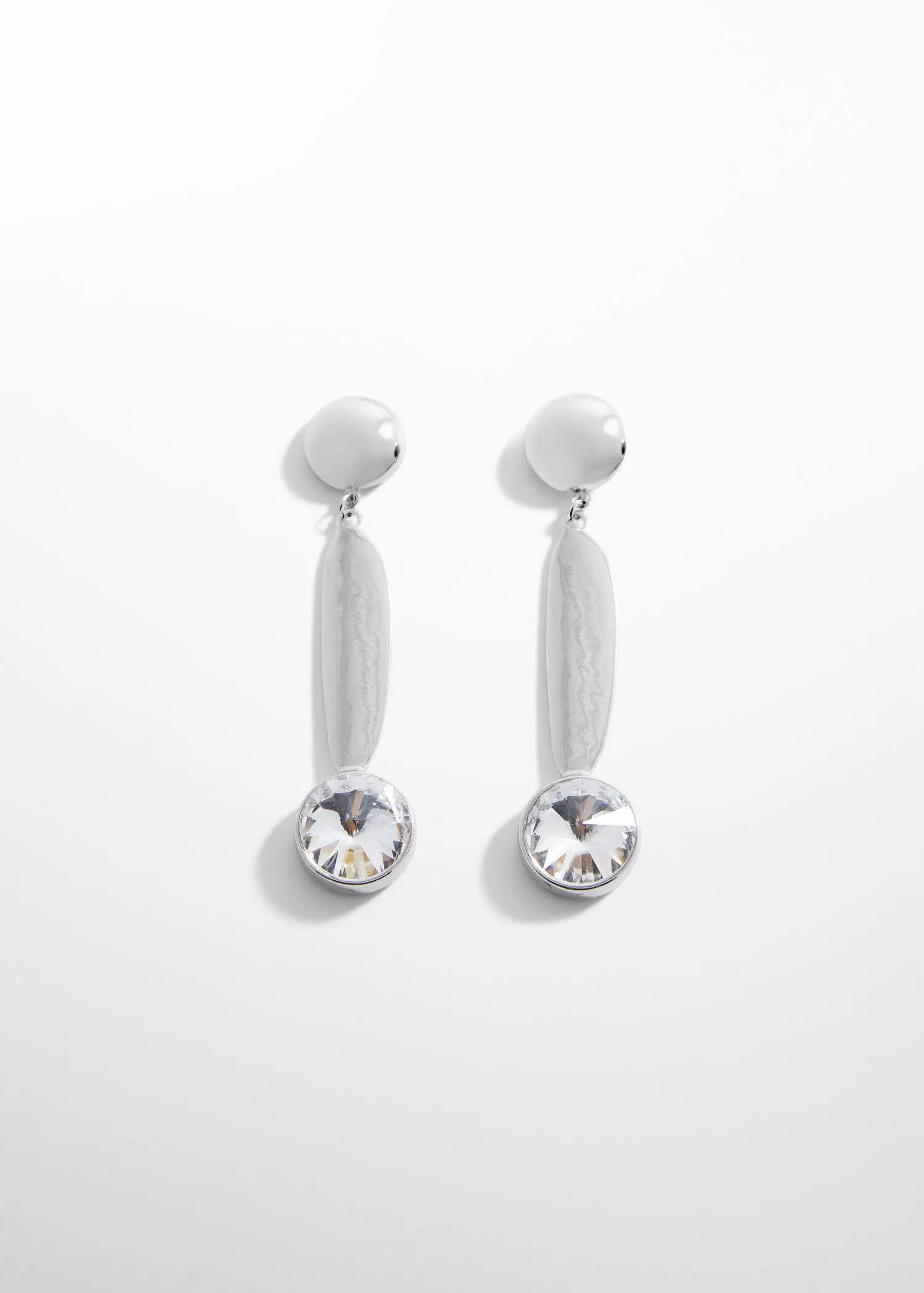 Mango Long crystal earrings . a pair of white earrings with a clear stone on them. 