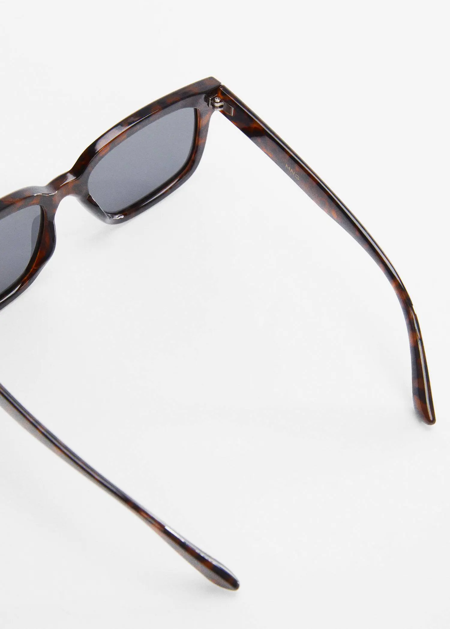 Mango Polarised sunglasses. a close up of a pair of sunglasses. 