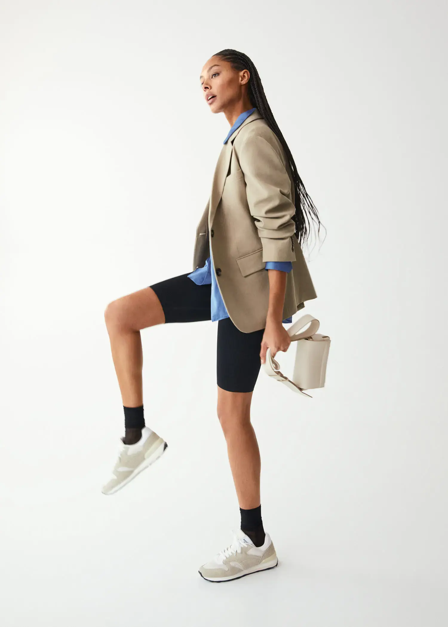 Mango Lace-up suede sneakers. a woman in a tan jacket and black shorts. 