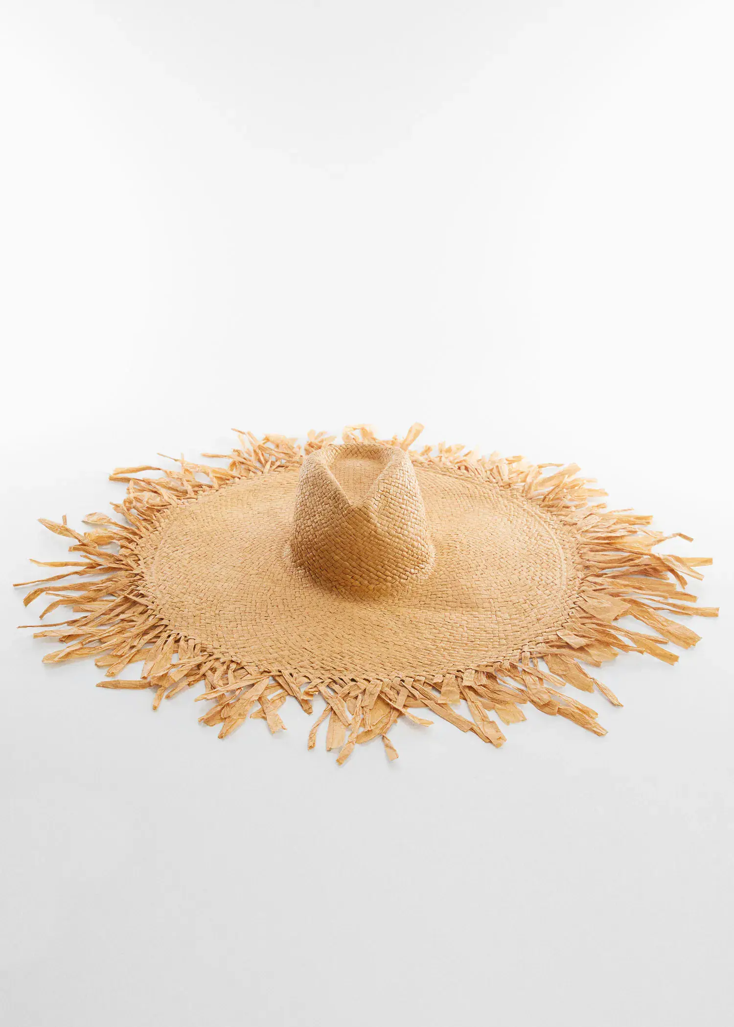 Mango Natural fibre maxi hat. a straw hat sitting on top of a white table. 